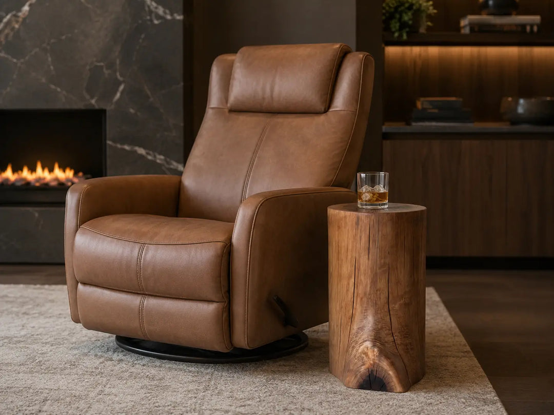 A black Walnut log side table with a beverage on top and next to a leather recliner and fire place.