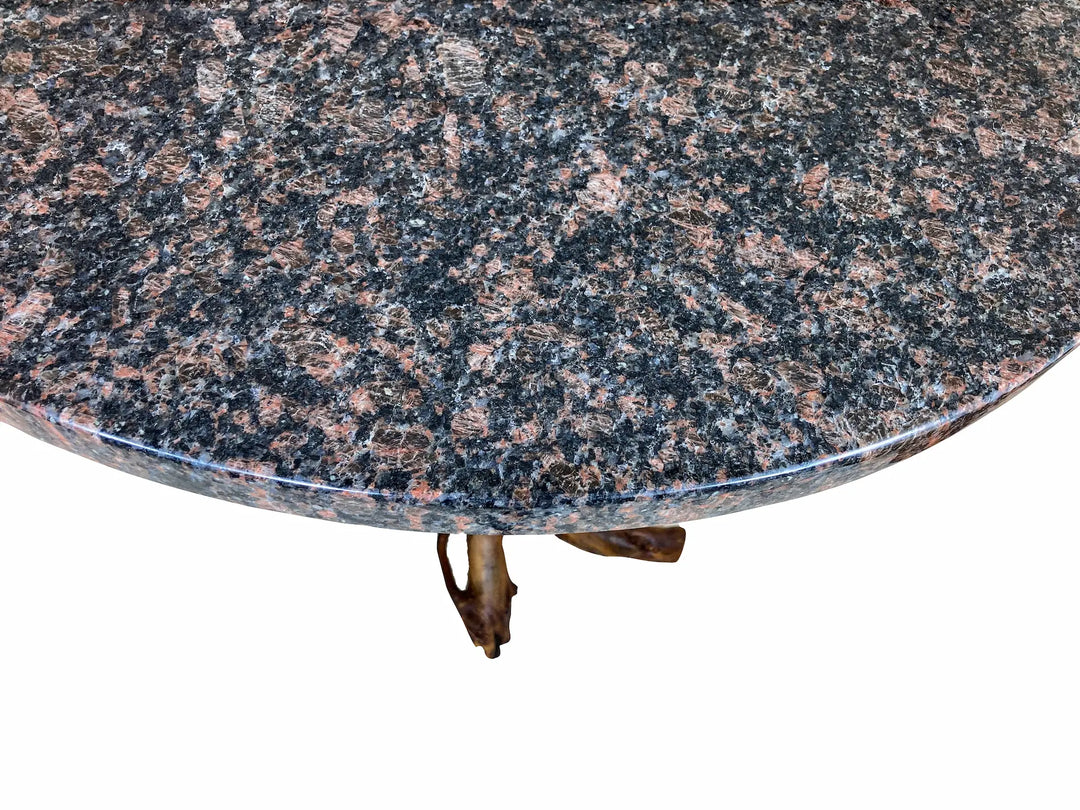 Close-up of a round Blue Dunes granite table top with a white background