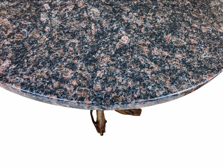 Close-up of a round Blue Dunes granite table top with a white background