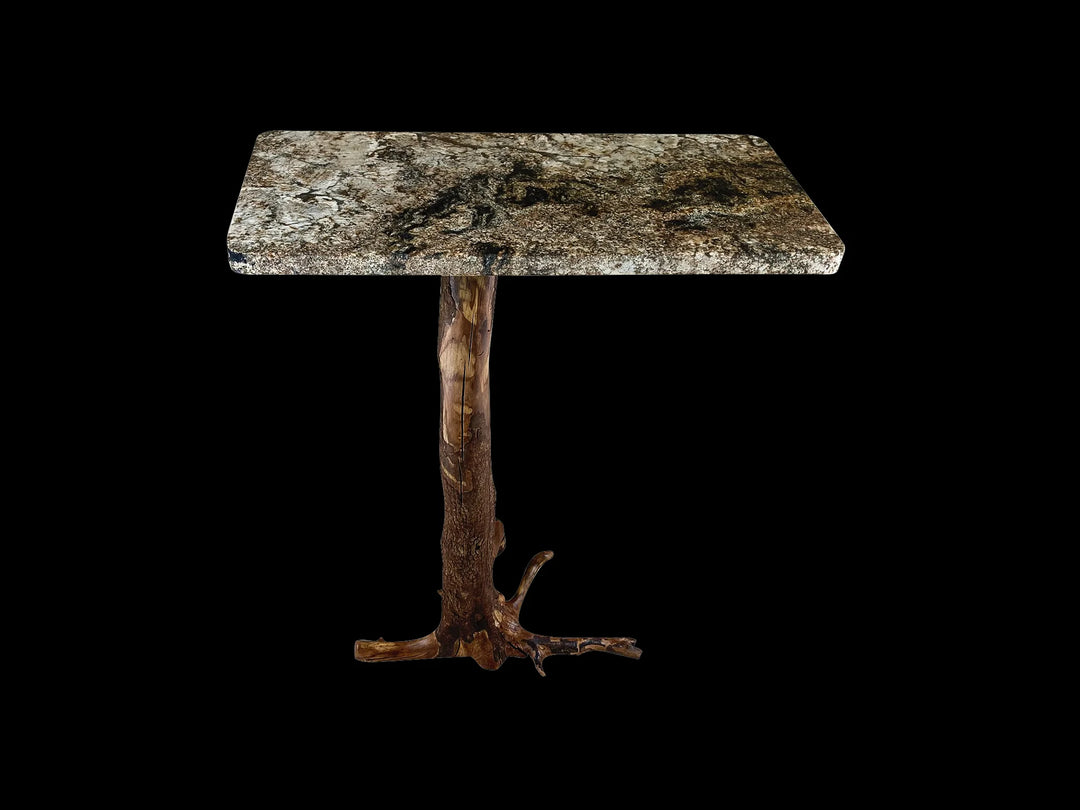 Back view of a rustic wood and stone granite console table on an oiled  Dogwood tree stump.