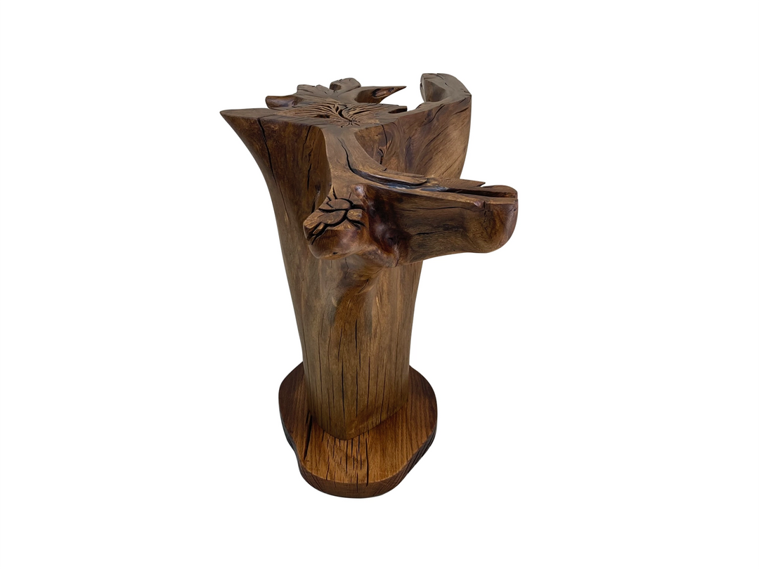 Side view of an oak tree stump dining table mounted to an organic shaped oak platform.