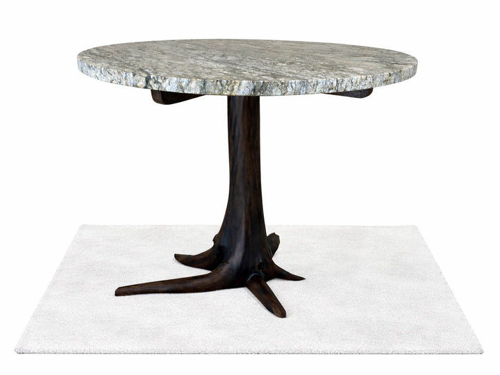 Front lower view of round granite top dining table on a black walnut tree stump base with white back ground