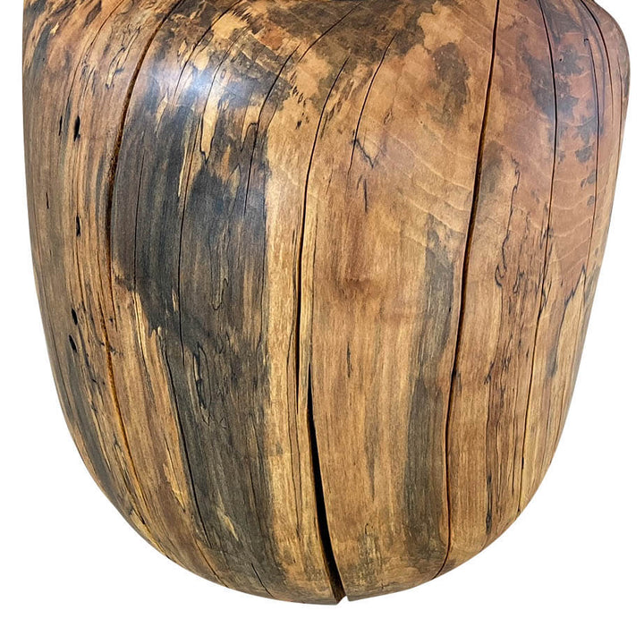 Close-up of the back side of a solid smooth carved chair from Sycamore with a matte oil finish with white background