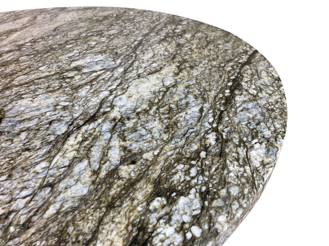 Top close-up of round blue dunes granite top showing beautiful grain patterns in the stone.  White, green, blue all running and swirling through out.