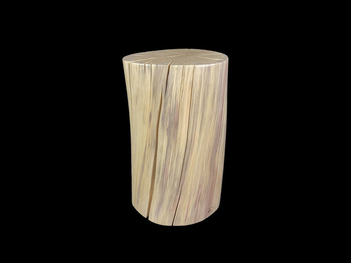 A cylindrical wooden side table with a natural wood grain pattern photographed against a solid black background.