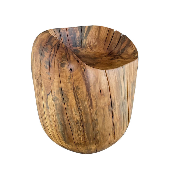 Angled view of solid hand carved sycamore chair.  Egg shape with a dip out of the top with white background.