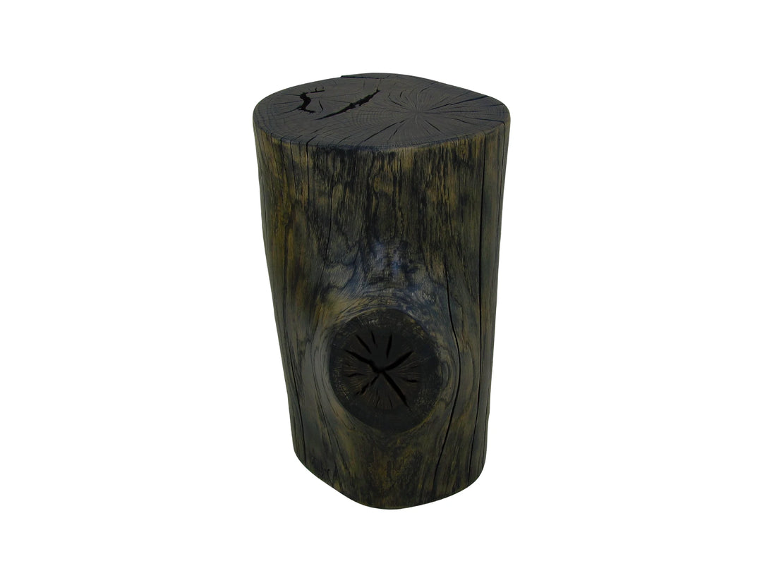 A rustic cylindrical oak log side table with a dark weathered finish, featuring a carved knot detail on the top surface, placed on a white background.