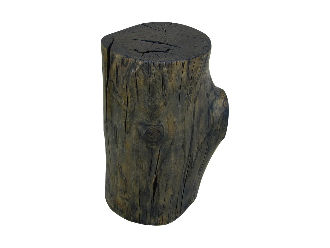 A rustic wood stump side table with a dark brown and black weathered finish on a white background.