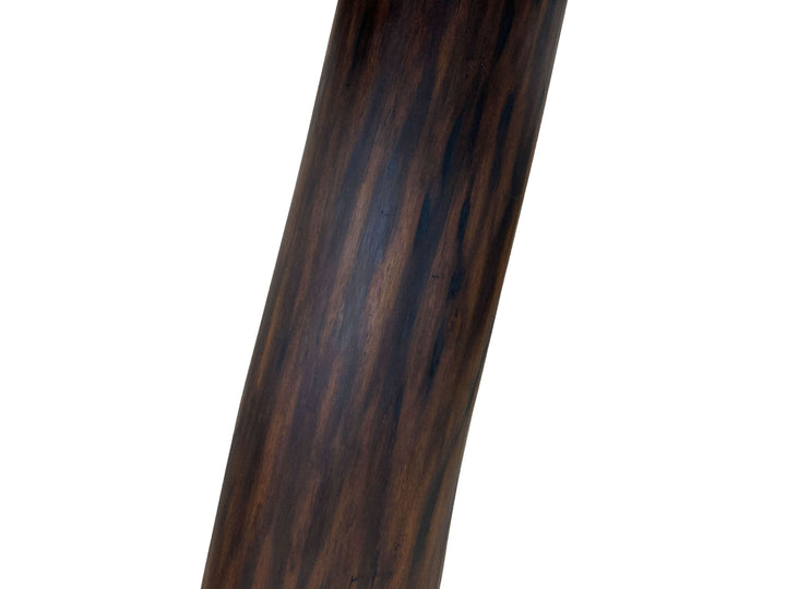 Close-up of a dark black walnut tree pedestal to support the table top with a white background