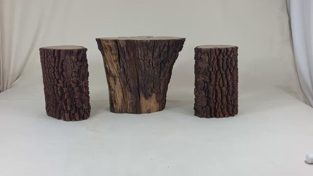 Video of 3 piece coffee table set of barked  sections of trees.
