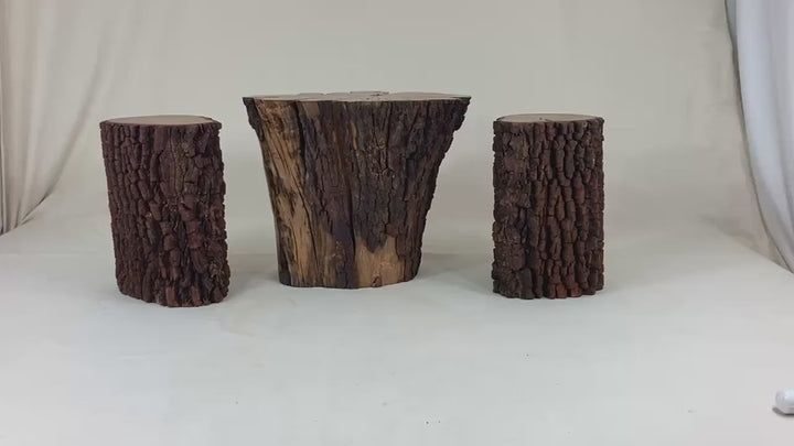 Video of 3 piece coffee table set of barked  sections of trees.