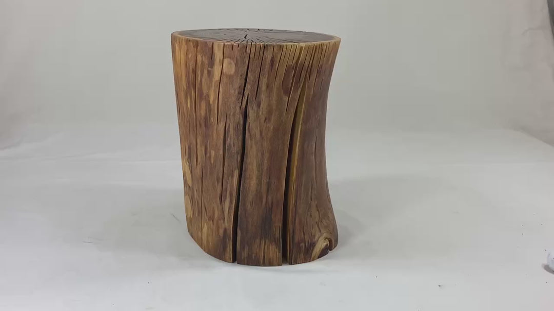 Video of a brown / yellow log side table against a white canvass back drop.