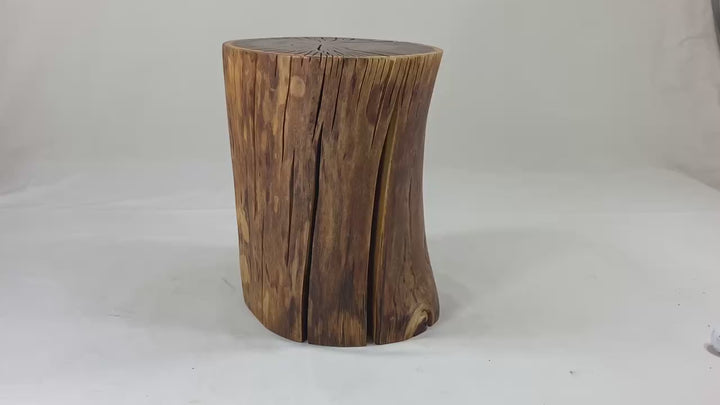 Video of a brown / yellow log side table against a white canvass back drop.
